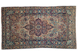 Antique Lavar Kerman rug, dramatic concentric medallion, ivory, navy, red, blue curvilinear florals.