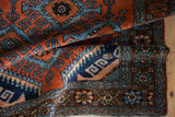 Vintage Persian Mehreban rug's brown main border with dusty wine and blue florals.