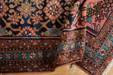 Vintage Lilihan rug's minor border with sky blue and chestnut reciprocating floral motifs.