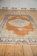 Distressed Persian Kerman rug corner, Rococo spandrel in light blue, ivory, and navy border.