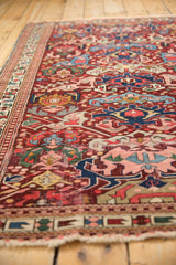Fine weave geometric floral arabesques in wine red, indigo, rose, and saffron on antique Seichor Kuba.