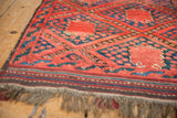Vintage Beshir rug: rich madder red and navy blue geometric trellis with thick pile texture.