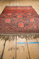 Natural tan fringe and striped flat weave band of the Vintage Beshir rug.