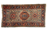 Vintage Heriz rug, triple medallion design with pinwheel florals, beige, terracotta, navy.