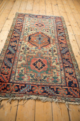 Vintage Heriz rug corner with serrated leaf main border and original polychromatic selvage.