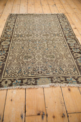 Distressed fringe and muted floral border with even wear on antique Farahan Sarouk rug.