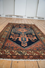 Vintage Mehreban rug's deep blue field with ornate medallion, fish motifs, and softened pile.