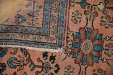 Vintage Lilihan rug detail showcasing the hand-knotted foundation, cream fringe, and intact pink side cord.