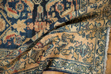 Distressed wide main border of a Lilihan rug with floral motifs and visible fringe.