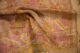 Soft distressed Oushak pile with faded raspberry, gold, and antique ivory tones.