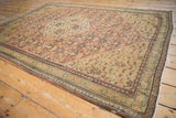 Fine distressed Senneh rug displaying an intricate Herati motif and even wear from an angle.