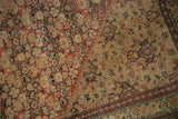 Even wear across the intricate Herati pattern of a fine antique Persian Senneh rug.
