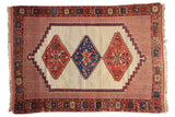 Antique Afshar rug with a triple center medallion in red and sapphire blue set on an unusual ivory ground.