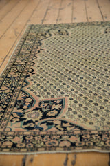 Antique Farahan Sarouk rug corner, blush rose and teal floral spandrel, navy germinating boteh field.