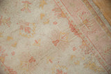 Corner detail of a vintage Oushak rug showing its mostly even wear down to the knot heads.