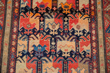 Detail of the antique Karabagh rug runner's side, showcasing its intricate geometric border and rich colorful pile.