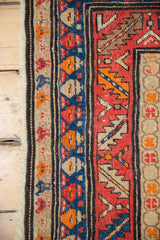 Antique Karabagh runner's border: vibrant geometric design, stylized blossoms, and intact fringe.