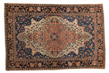 Antique Persian Farahan Sarouk rug: oversized scalloped medallion, floral vines, indigo, ivory, blush.
