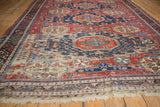 Antique Caucasian Soumac detail with exposed foundation, tatter, and geometric pinwheel florals.