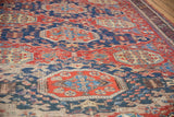 Hand woven cherry red and navy blue geometric Soumac carpet with low pile.