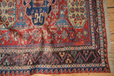 Antique Caucasian Soumac rug corner: geometric dark border, exposed foundation, fringe.
