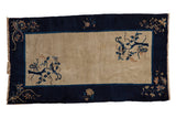 Vintage Chinese Peking rug, beige field, cobalt blue border, featuring corner bird-on-tree motifs.
