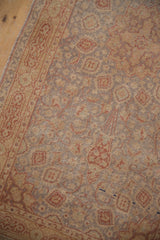 Vintage Amritsar rug with Ardebil floral design, silver, beige, and terra cotta tones, showing wear.