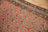 Brick red Malayer rug field with sky blue boteh and plant motifs, showing even knot head wear.