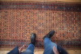 Detail of hand knotted Persian Serab runner with henna plant lattice pattern, camel and sapphire tones.