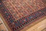 Intact camel hair selvage and traditional geometric sapphire blue border of vintage Serab rug runner.