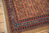 Camel hair side cord selvage and patterned sapphire blue border on a vintage Serab rug.