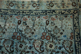 Distressed dusty powder blue Meshed rug with arts and crafts florals and dark indigo.