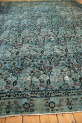Vintage Distressed Persian Meshed rug detail, arts and crafts germinating plants on dusty powder blue field.