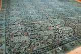 Distressed Meshed carpet detail: dusty blue field, arts and crafts botehs, visible foundation.