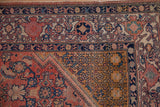 Antique Malayer rug corner with deep saffron spandrel, geometric leaves, and navy Samovar border.