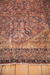 Antique Malayer rug detail: navy Samovar Turtle main border, deep saffron spandrel, and areas of foundation from wear.