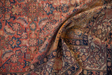 Antique Persian Malayer rug detail, showing its navy Samovar Turtle border and woven foundation.