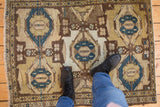 Distressed Hamadan rug with geometric medallions, trellis patterns, and deep cobalt blue.