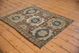 Distressed Hamadan rug's coffee brown trellis and cobalt blue medallions.