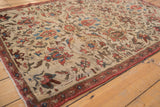 Ivory ground antique Fereghan rug, with terracotta lotus motifs and blue connecting vinery.