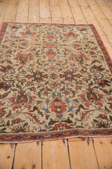 Fereghan rug: ivory ground with terracotta lotus flowers, blue vinery, and boteh border.