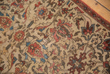 Ivory field, antique Fereghan rug, expressive lotus flowers, vinery in terracotta, sky blue.
