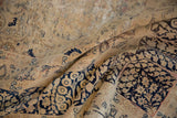 Distressed Vintage Kerman rug texture with worn dark navy blue floral vinery on an antique ivory field.