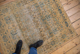 Distressed vintage Meshed rug detail, highlighting gold, blue, sand tree of life pattern and visible foundation.