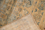 Distressed vintage Meshed rug showing gold pile, blue tree of life motifs, and visible foundation.