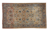 Distressed vintage Tabriz rug with pale blue field, allover gold, indigo, and terracotta palmettes.