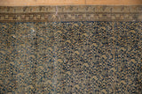 Distressed antique Malayer rug showing navy blue European-influenced lattice pattern and warm beige tones.