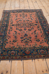 Antique Manchester Kashan's dusty rose field with scrolling floral vinery, cobalt blue border, and wear.