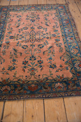 Antique Manchester Kashan rug: cobalt blue border, dusty rose field, scrolling floral design.