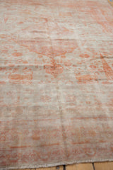 Distressed vintage Sivas carpet with a pale rust hunting motif, showing a stylized lion.